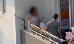 Kadını balkonda sopa ile darp etti