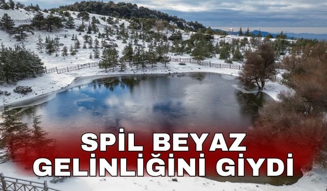 Spil beyaz gelinliğini giydi