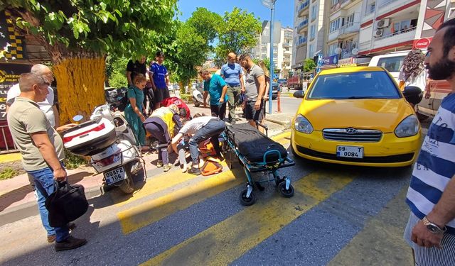 Yolun karşısına geçmek isteyen kadına taksi çarptı