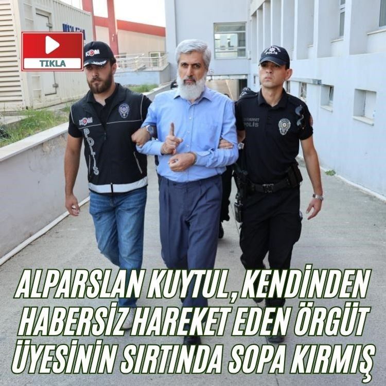 Alparslan Kuytul, kendinden habersiz hareket eden örgüt üyesinin sırtında sopa kırmış