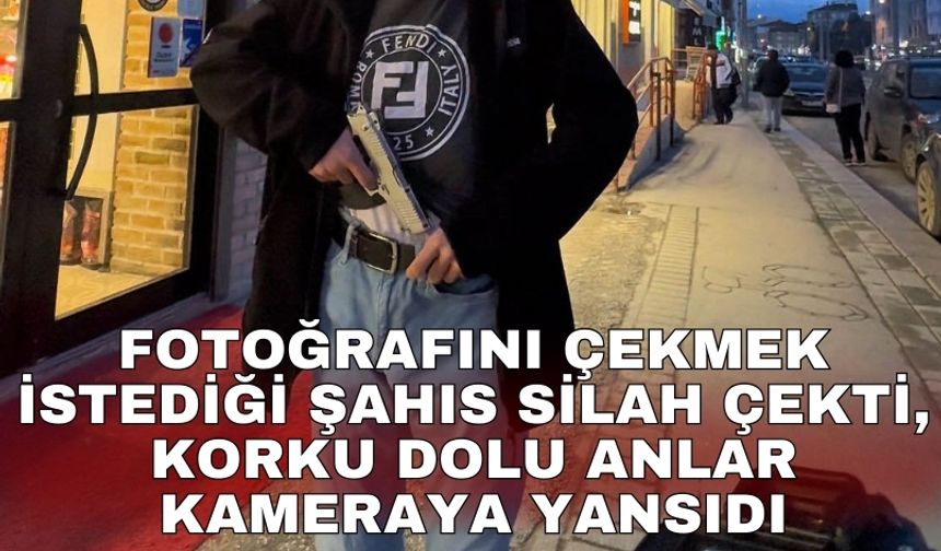 Fotoğrafını çekmek istediği şahıs silah çekti, korku dolu anlar kameraya yansıdı